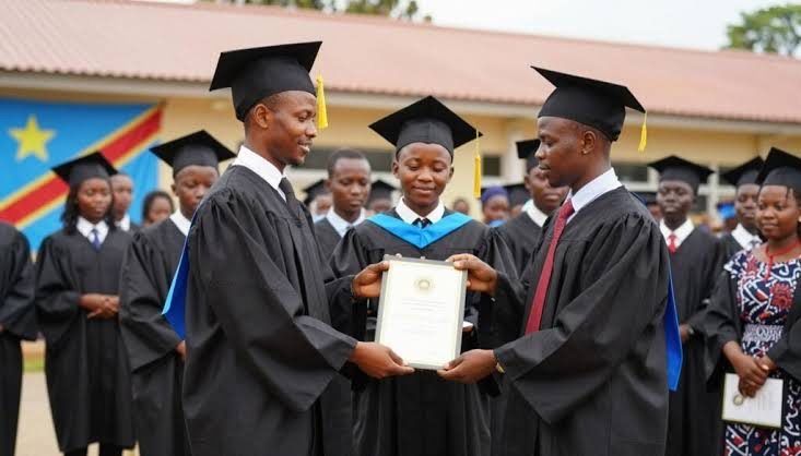 University graduates in caps and gowns celebrating in the DRC