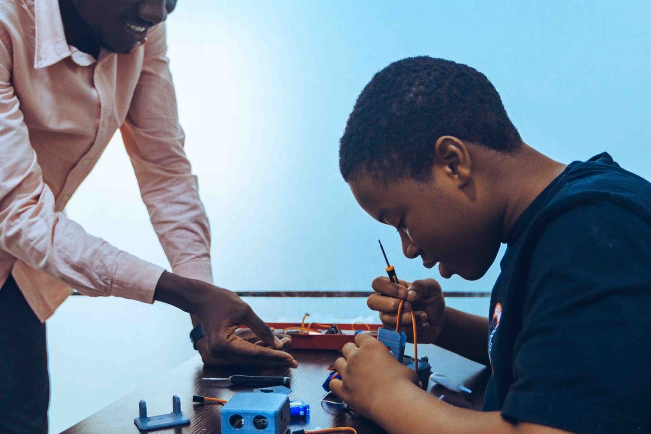 A young person working with vocational tools through an innovation program in the DRC